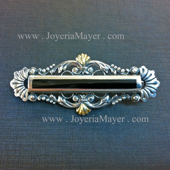 Silver, gold and jet brooch
