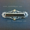Silver, gold and jet brooch