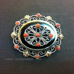 Broche de plata, oro y azabache