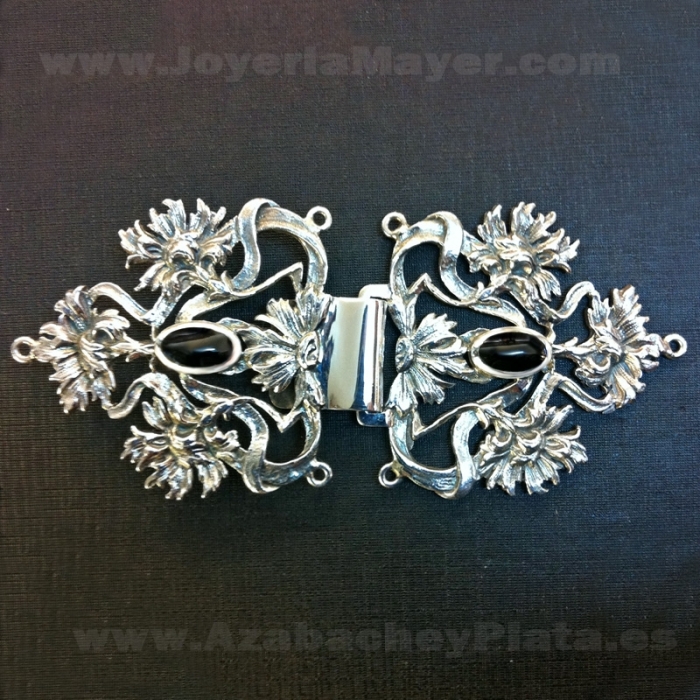Silver and jet cape brooch
